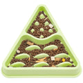 Triangular green pet feeder with brown pet food inside on a white background