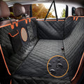 Car interior with black and orange quilted bench seat cover, showing water droplet detail.