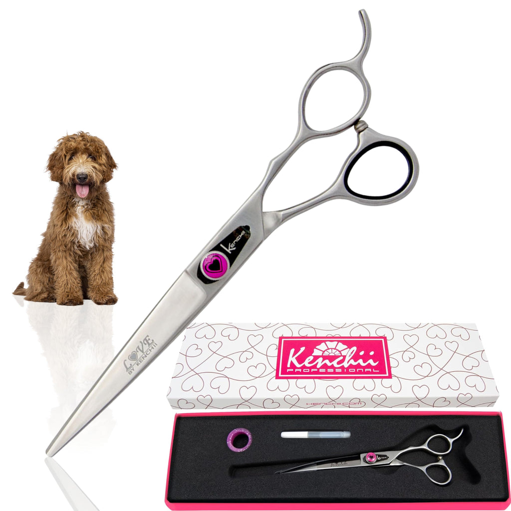Dog grooming shears with a pink and black case on a white background
