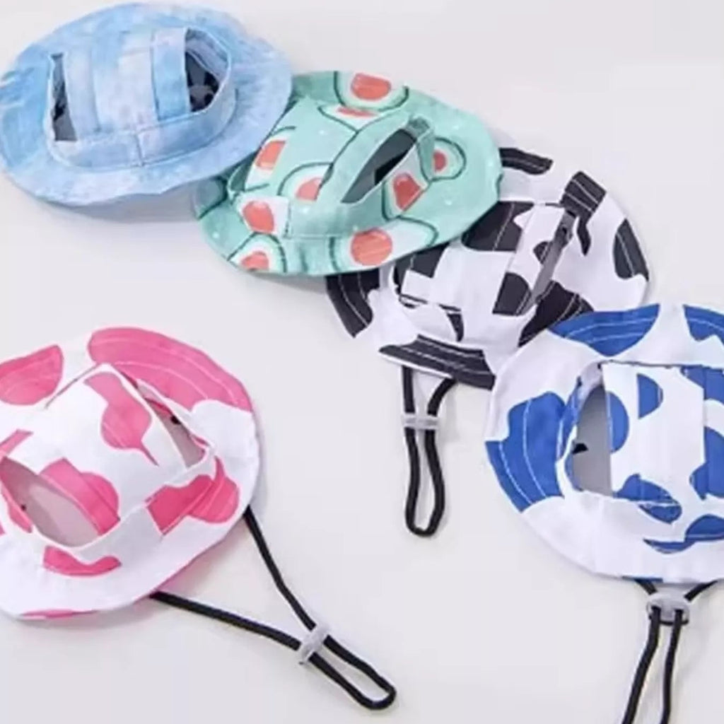 Set of colorful baby hats with various patterns on a white surface