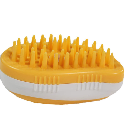 Yellow grooming brush with textured surface on a white background