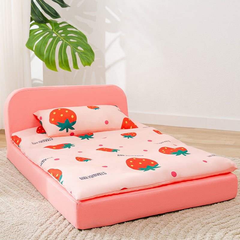 Pink dog's bed with strawberry pattern in a room setting