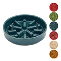 Teal slow feeder dog bowl with additional color options displayed on a white background