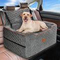 Dog sitting on a gray car seat cover in a vehicle with a blue sky background