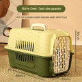 Green pet carrier with dimensions on a wooden surface