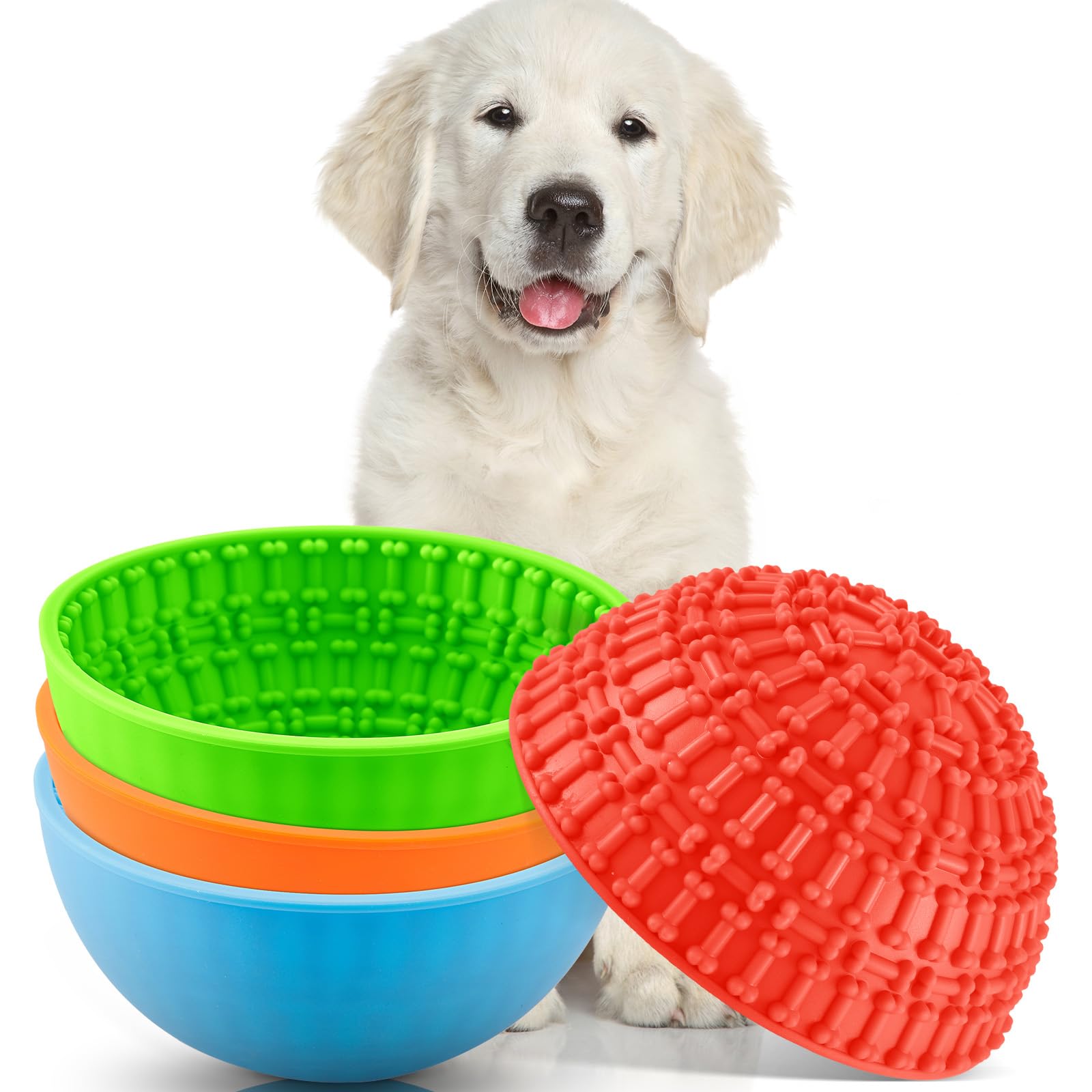 Dog with colorful silicone bowls and a ball on a white background