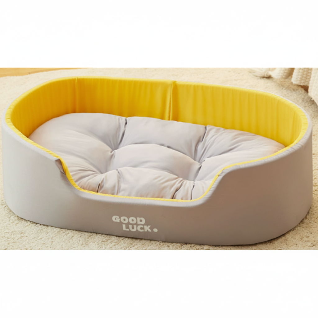 Pet bed with yellow rim and gray cushion labeled 'Good Luck' on a beige carpet.