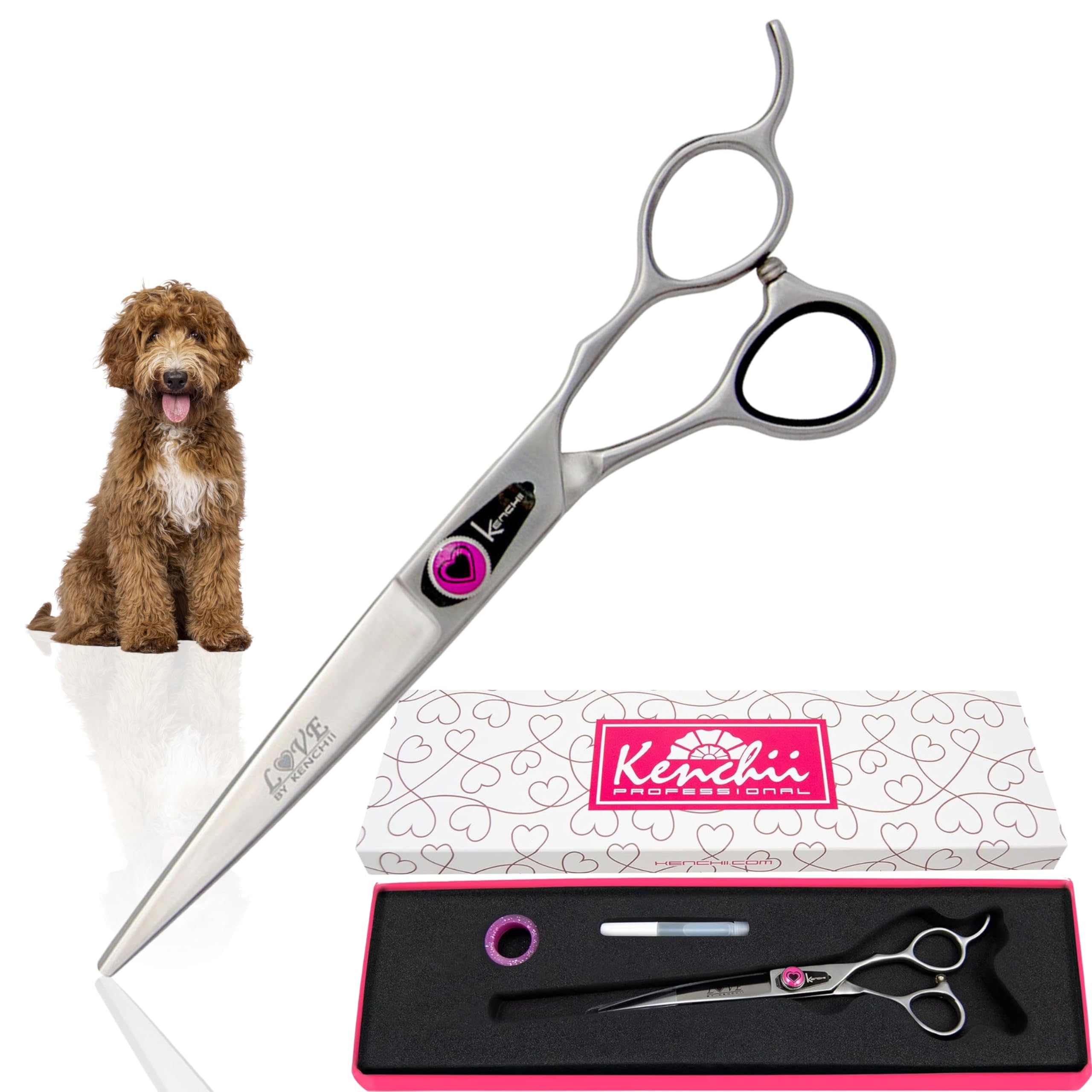 Dog grooming shears with a pink and black case on a white background
