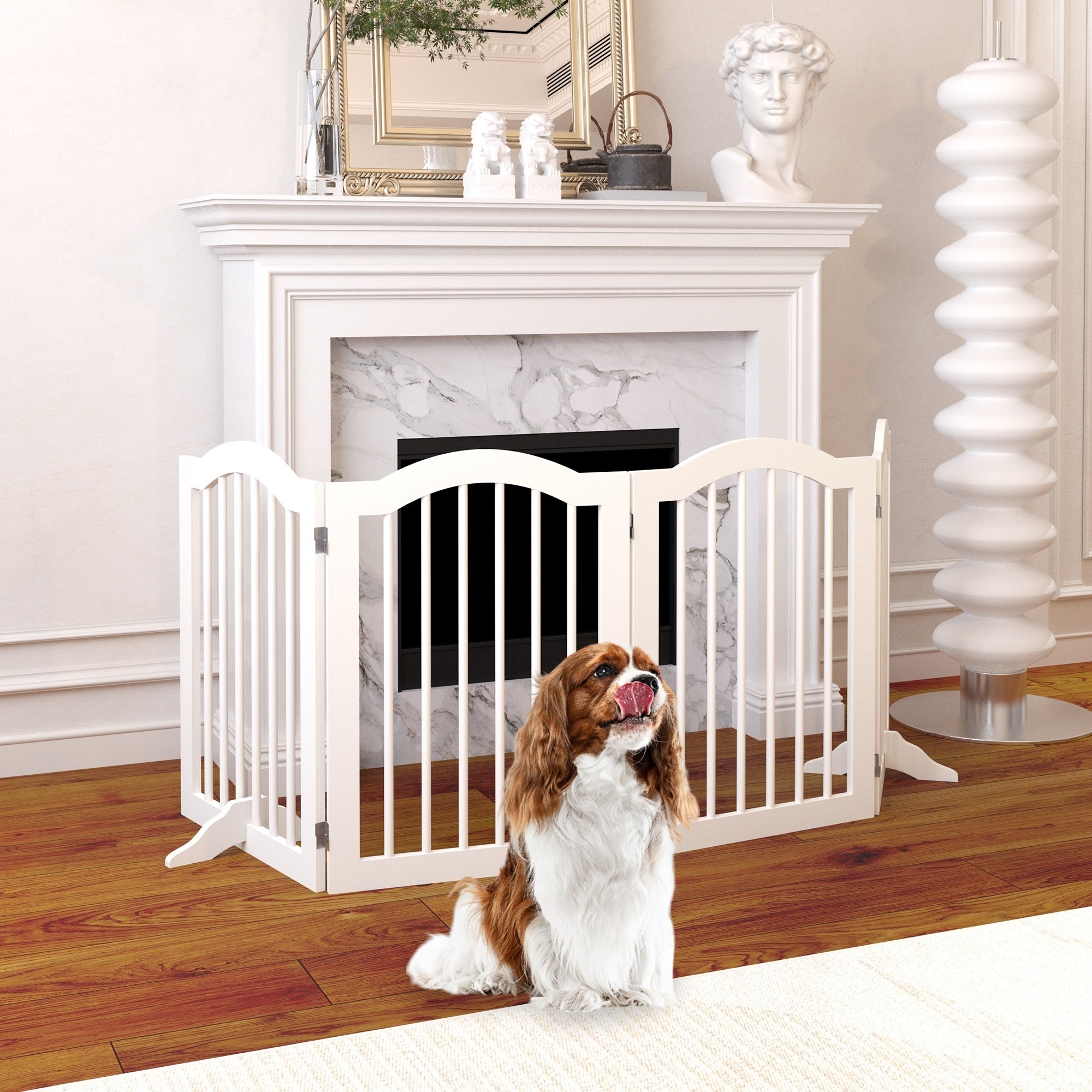 Dog sitting in front of a white pet gate in a home setting with a fireplace.
