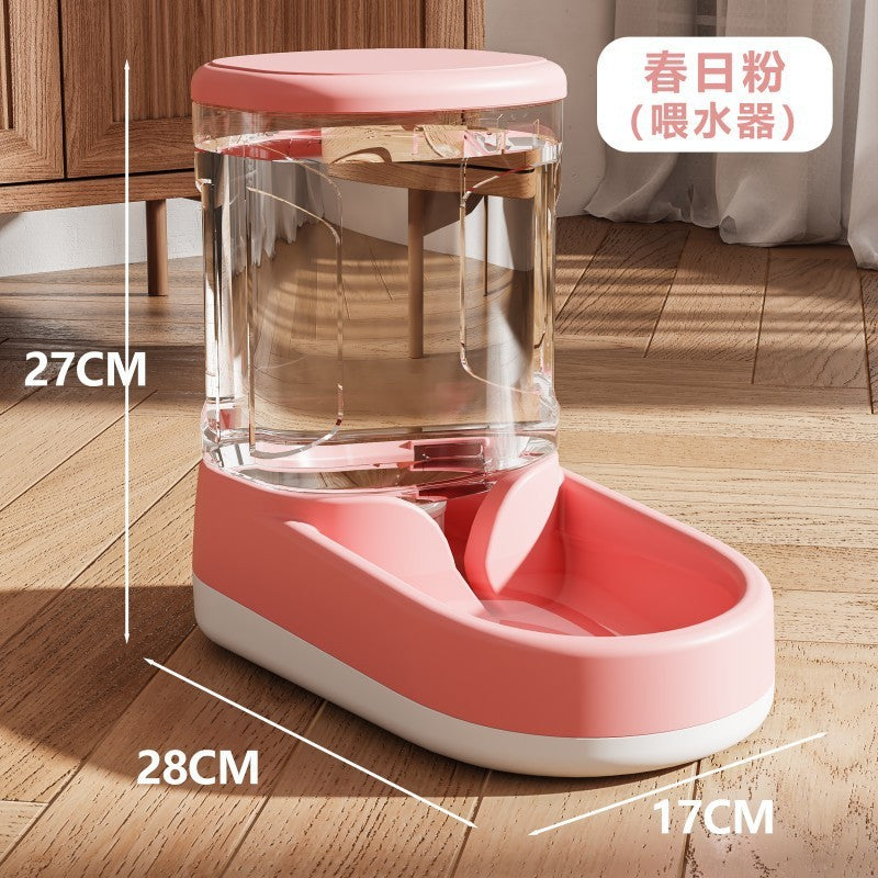 Pink and clear pet feeder with dimensions on a wooden floor