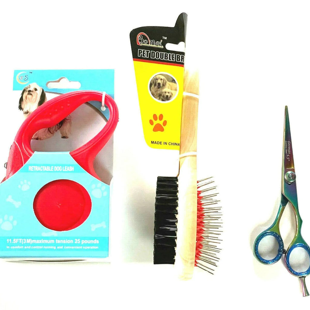 Pet grooming tools including a red brush, comb, and scissors on a white background