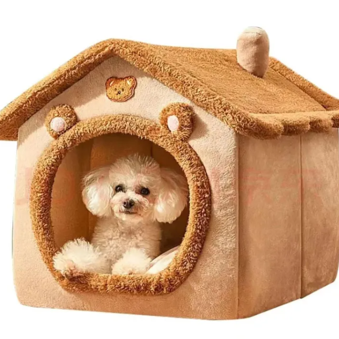 Small white dog inside a beige pet house with a brown roof on a white background