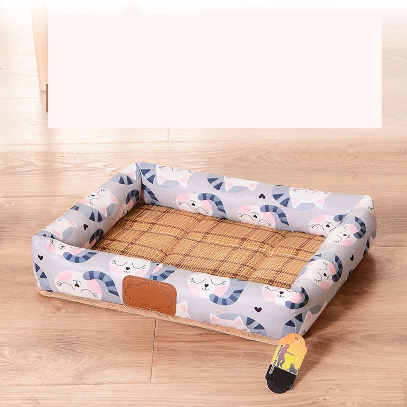 Pet bed with cartoon cat pattern on a wooden floor