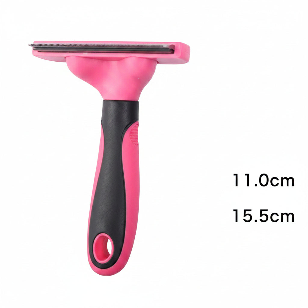 Pink and black pet grooming brush with measurements on a dark background