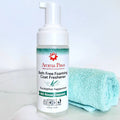 Aroma Paws Bath Free Foaming Coat Freshener bottle with a towel on a light background
