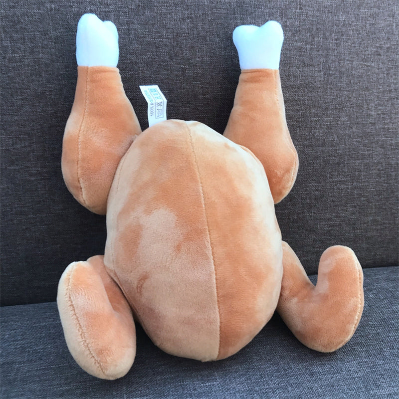 Plush toy resembling a dog with blue paws on a gray background