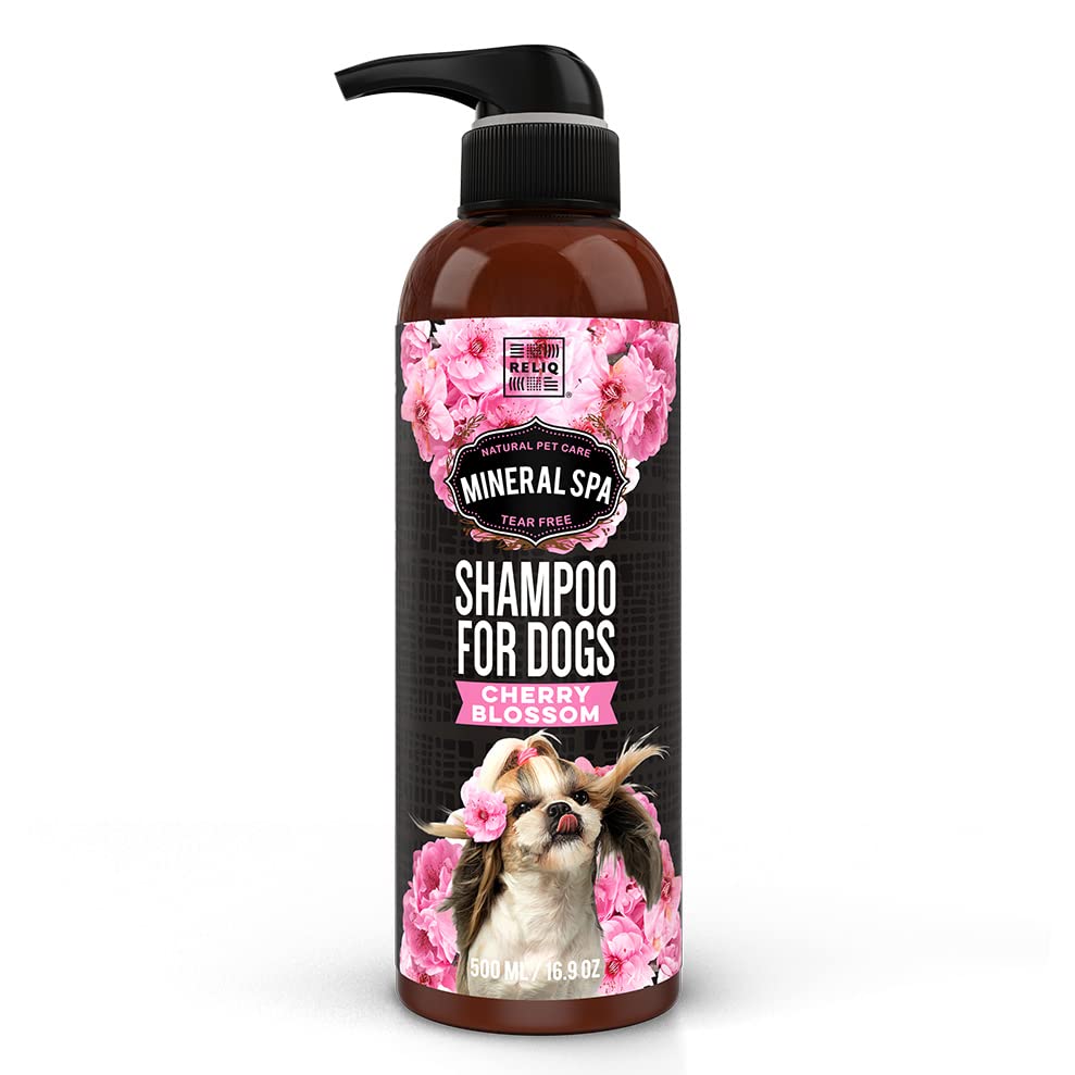 Bottle of dog shampoo with floral design and pump on a white background