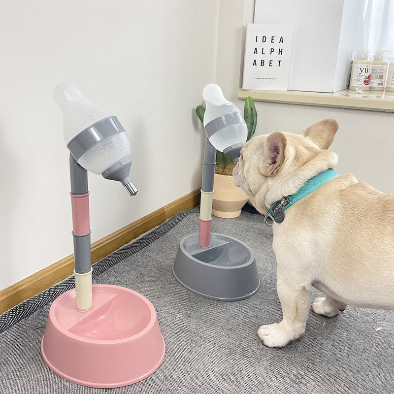 Two pet water dispensers, one pink and one gray, on a carpeted floor with a dog standing nearby.