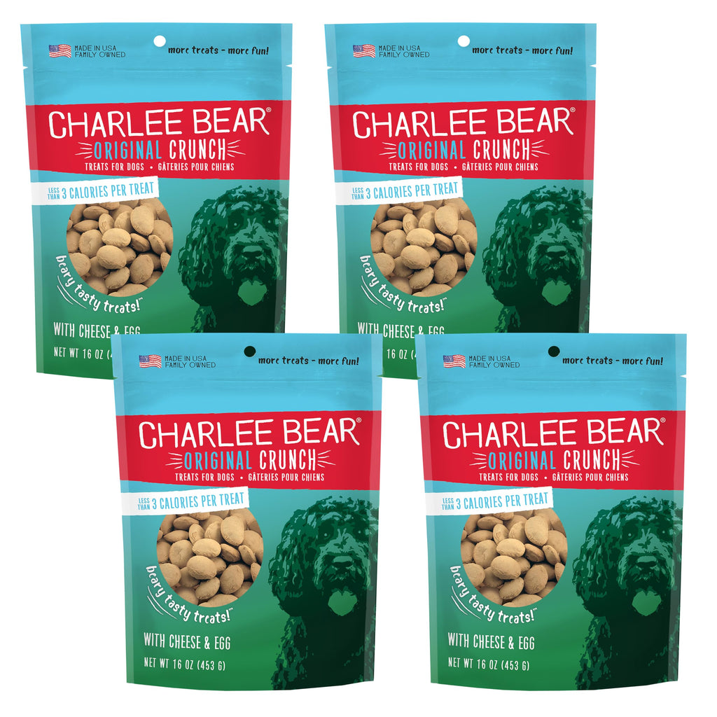 Four packages of Charlee Bear Original Crunch dog treats on a white background