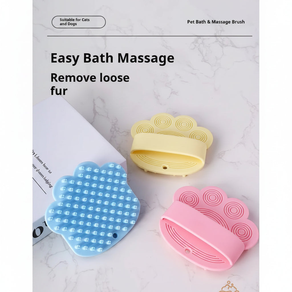 Three pet bath and massage brushes in blue, yellow, and pink on a marble surface.