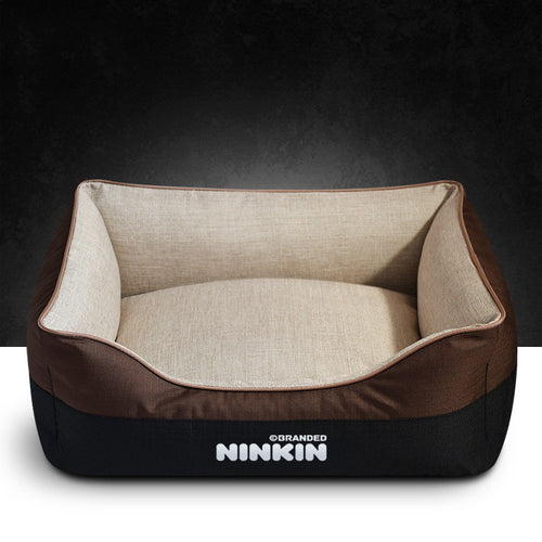 Pet bed with brown and beige color scheme on a dark background