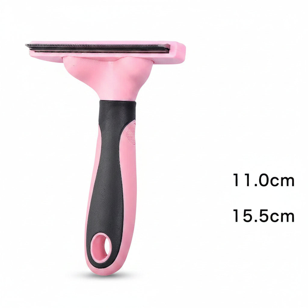 Pink and black pet grooming brush on a dark background with measurements indicated.