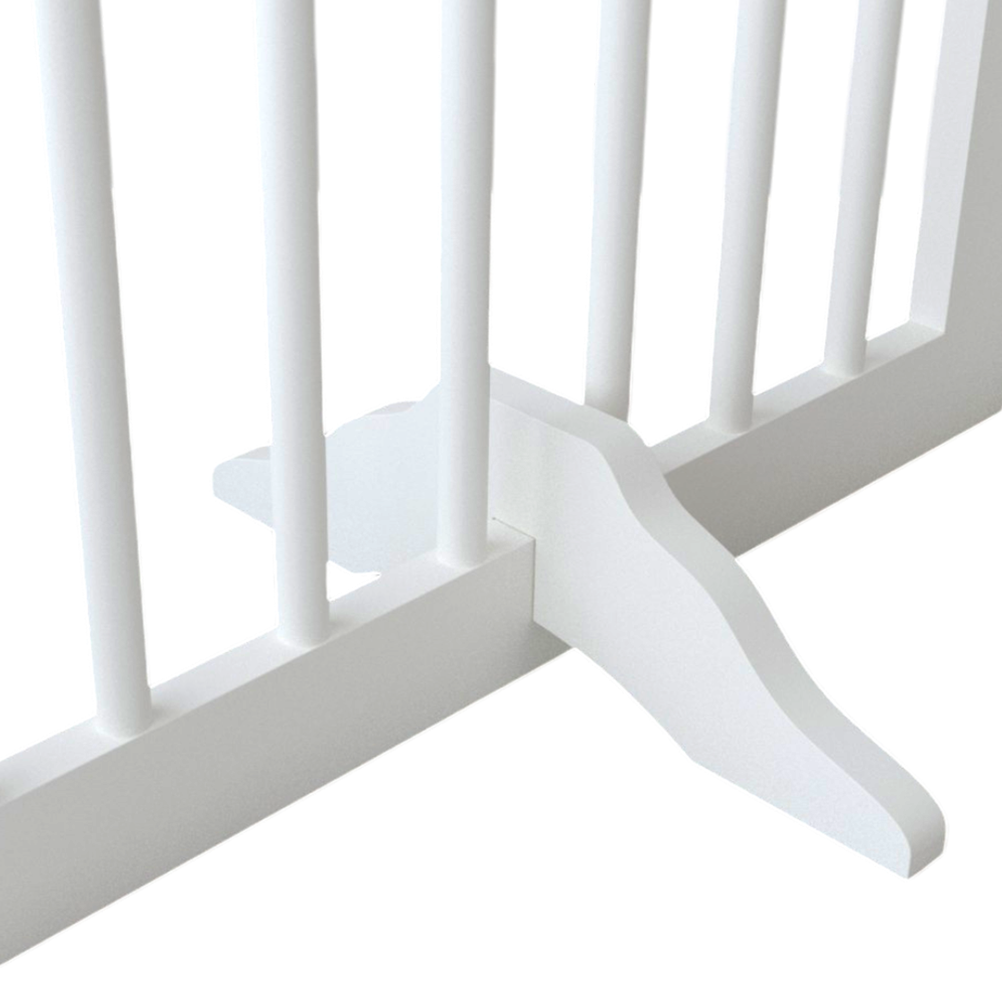 Close-up of a white crib with slatted design on a light gray background