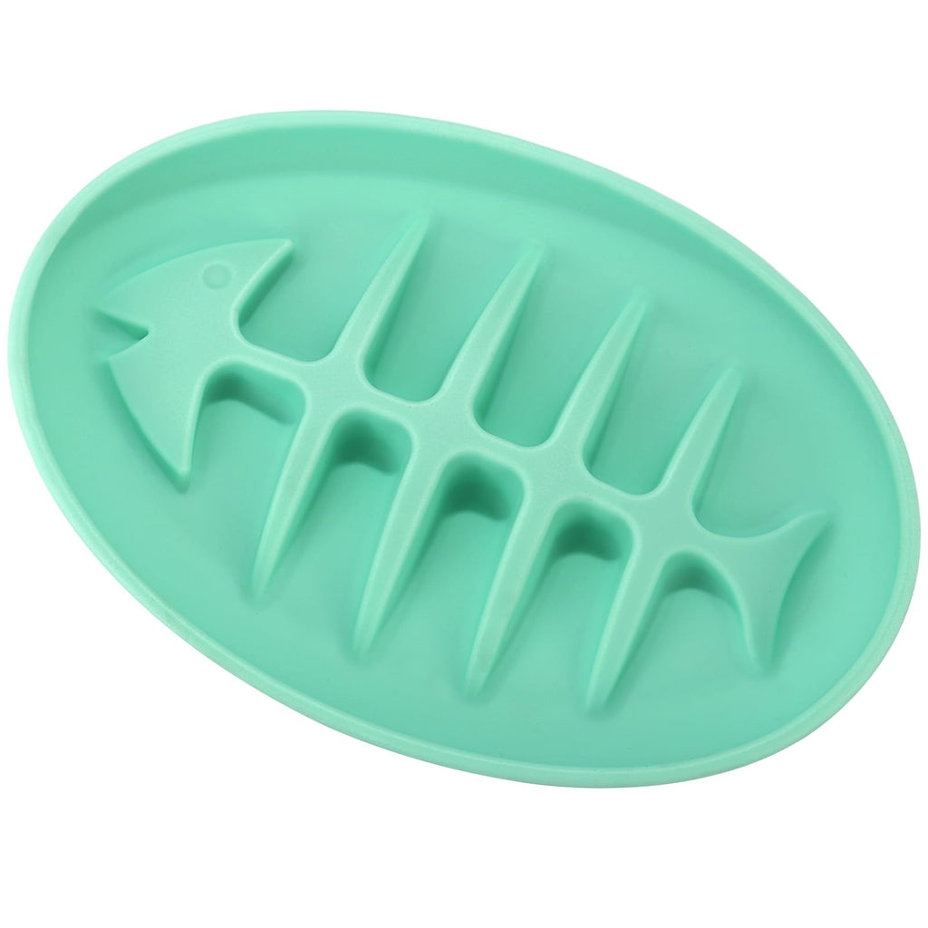 Green silicone mold shaped like a fish on a white background