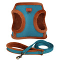 Blue and brown dog harness and leash set on a white background