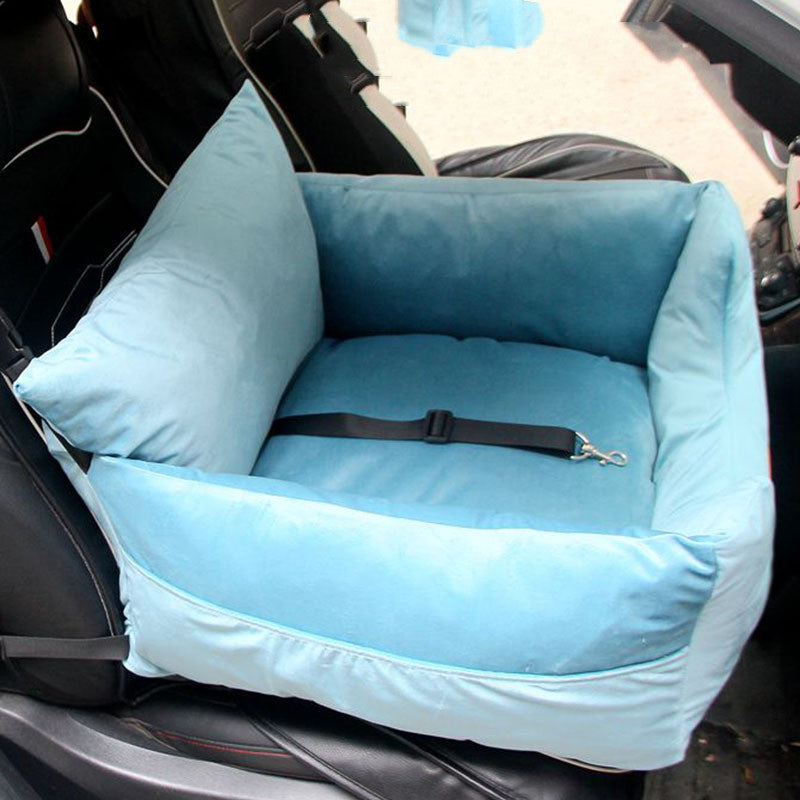 Blue pet car seat with straps on a car seat in a vehicle