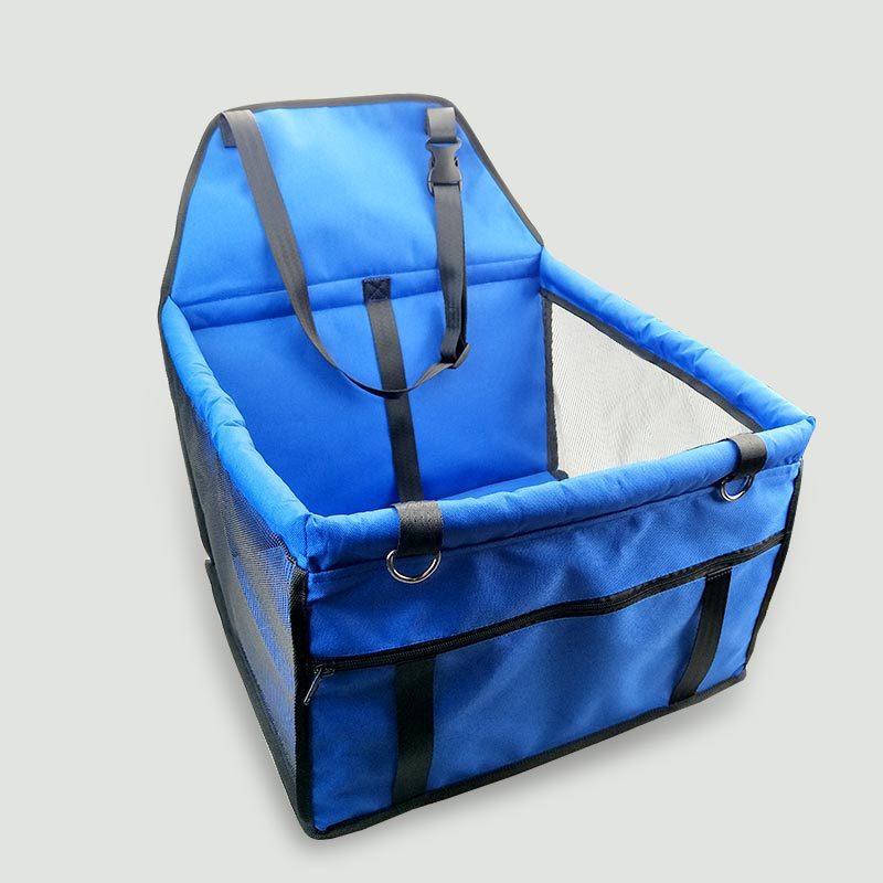 Blue pet carrier with black straps on a light gray background