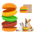 Hamburger-shaped pet toy with a cat and dog sitting next to it on a white background