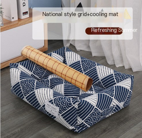 Blue and white patterned cooling mat with a bamboo roller on a wooden floor.
