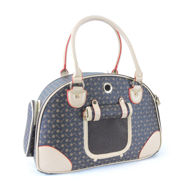 Blue and white patterned pet carrier with a handle on a white background