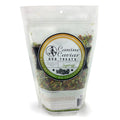 Bag of Canine Caviar dog treats with a label on a white background