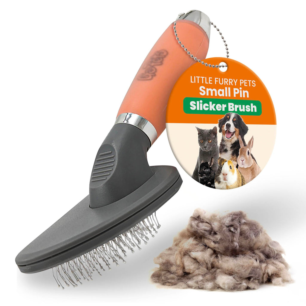 Pet grooming brush with collected fur on a white background