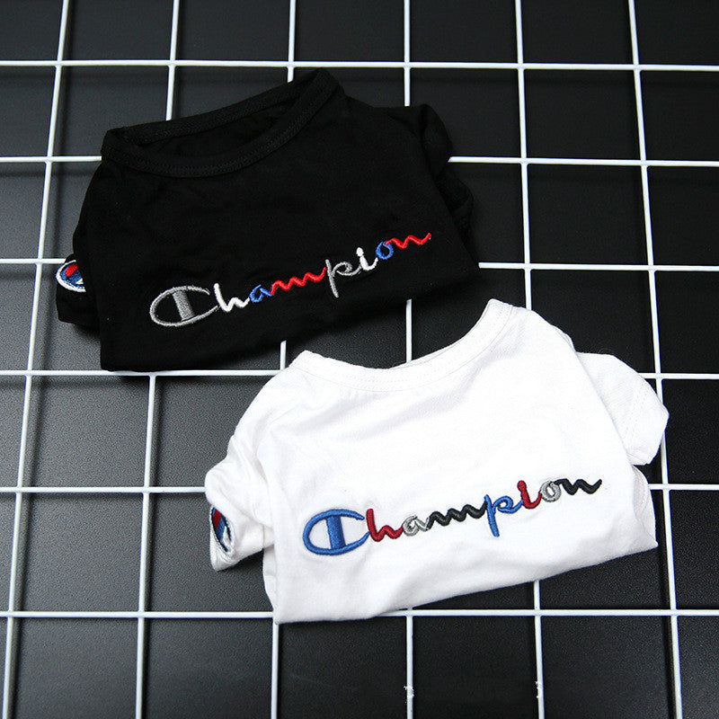 Black and white t-shirts with Champion logo on a grid background