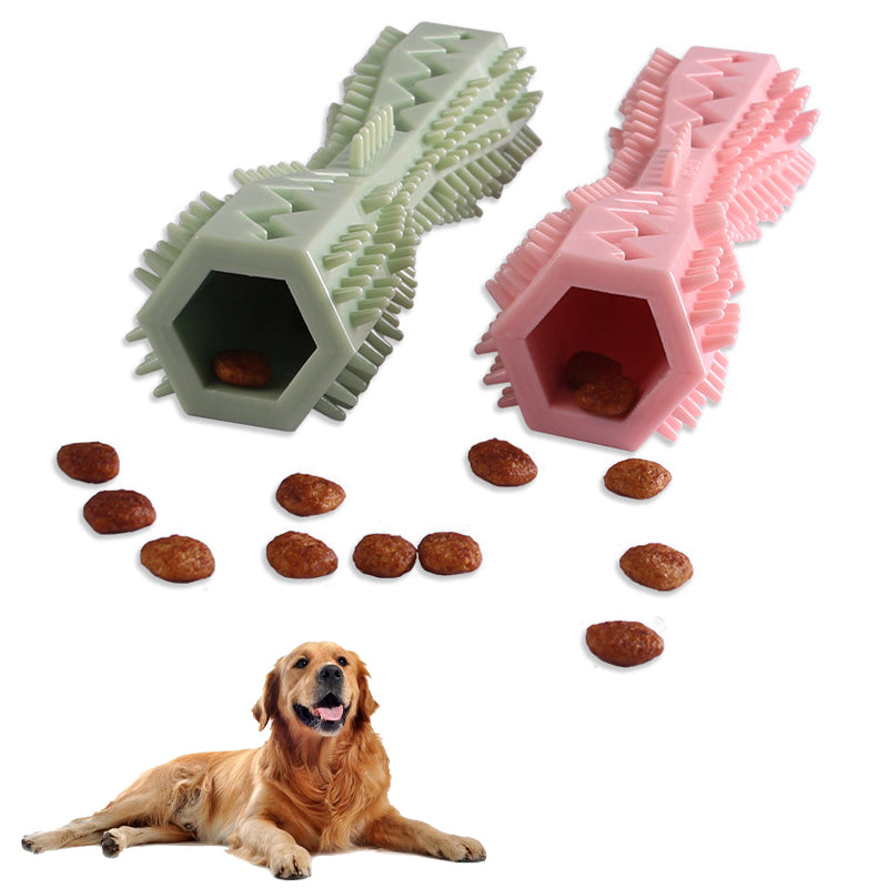 Two dog toys, one green and one pink, with a dog lying next to them on a white background.