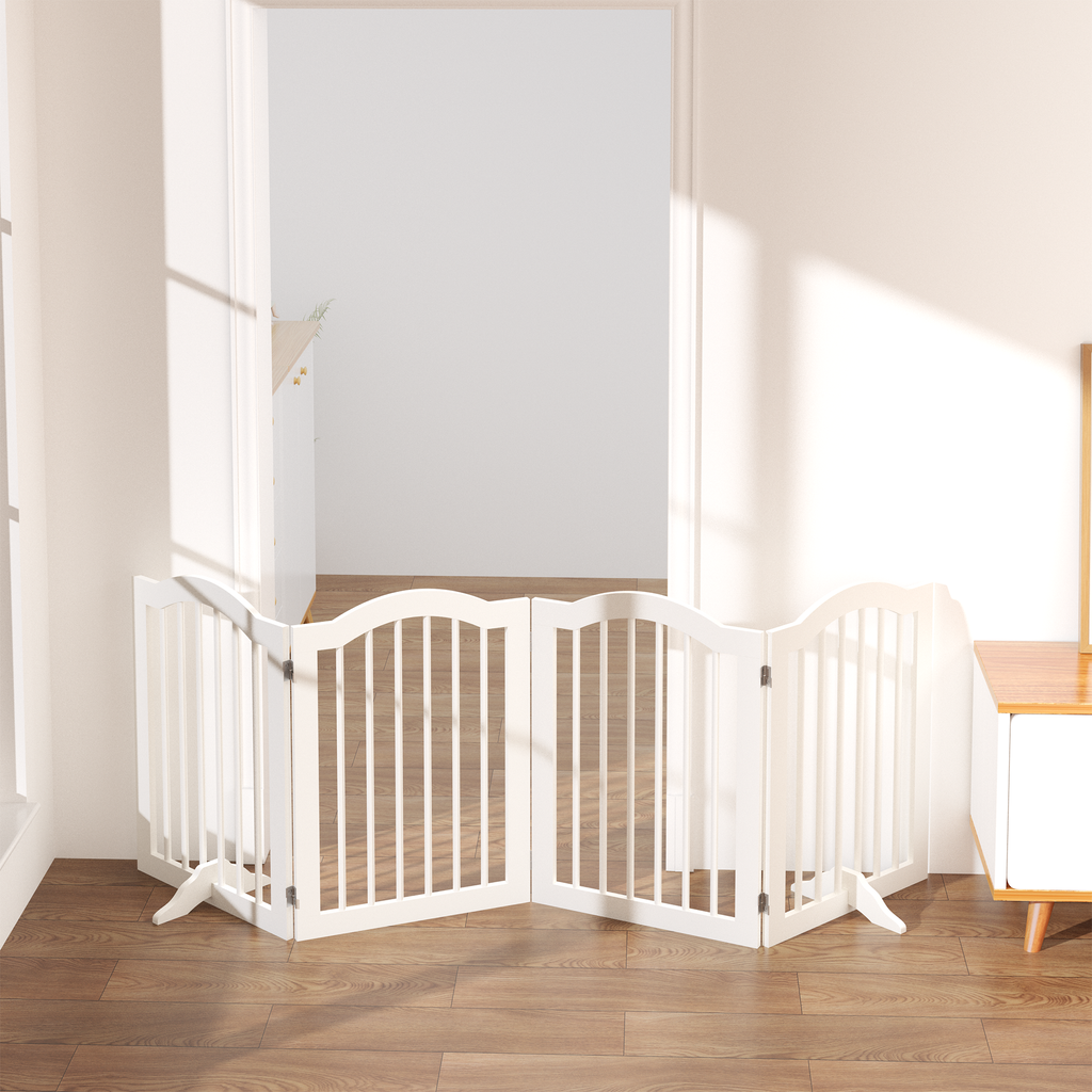 White pet gate in a room with wooden flooring and a table.