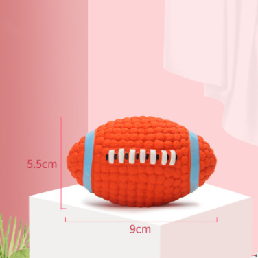 Red textured football-shaped toy with measurements on a pink background