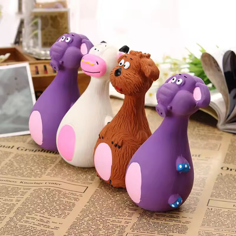 Four colorful animal figurines on a newspaper background