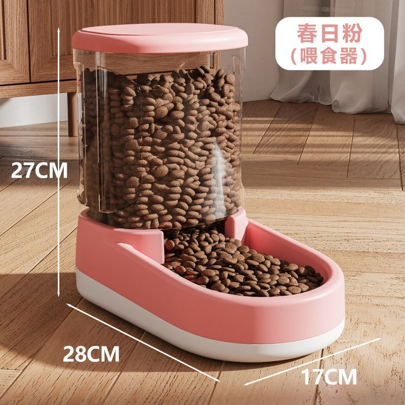 Pink pet food dispenser with measurements on a wooden floor