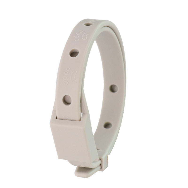 White plastic band with holes on a white background