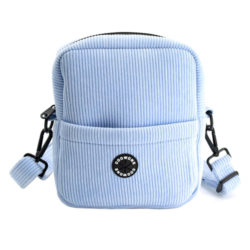 Light blue corduroy pouch with black strap and logo on a white background
