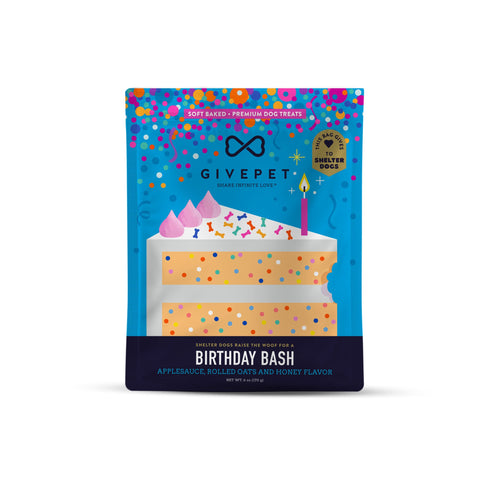 Dog treat package with birthday cake design and colorful polka dots on a white background