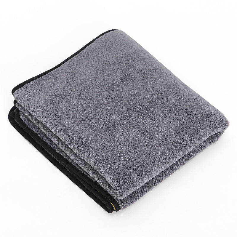 Gray towel with black edge on a white background