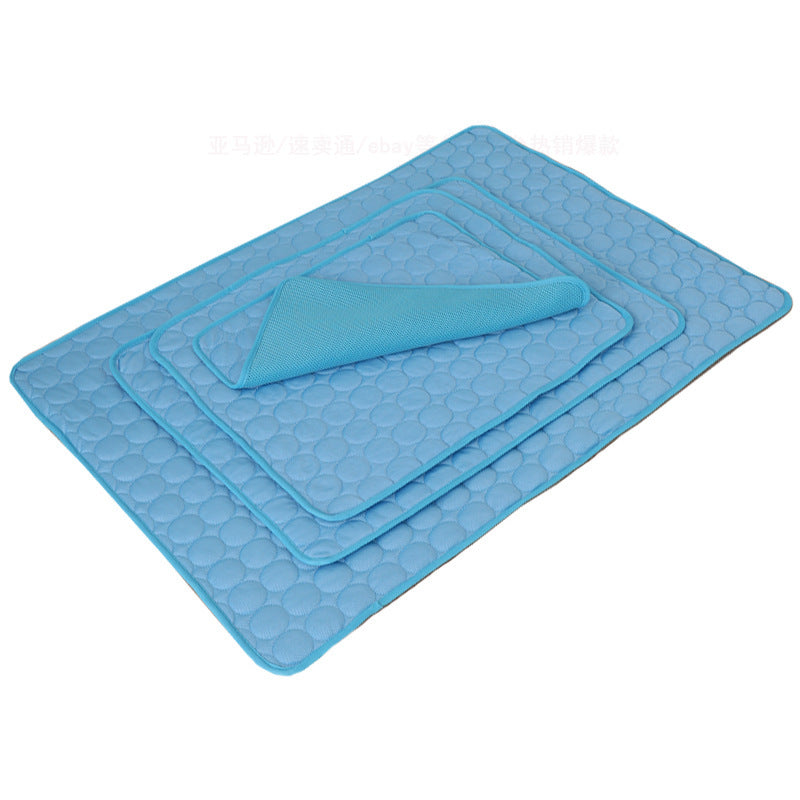 Set of blue textured bath mats on a white background