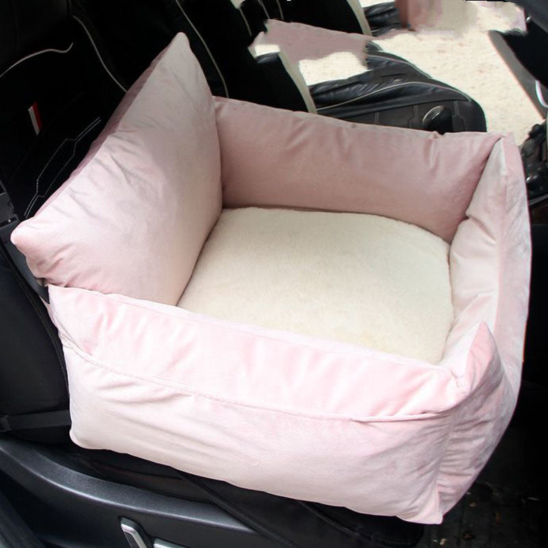 Pink pet bed inside a car seat