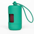 Green silicone lip balm case with a string on a white background