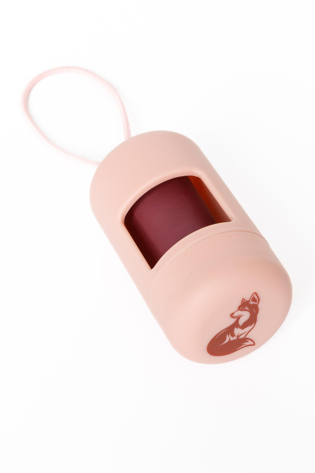 Pink lip balm case with a fox design on a white background